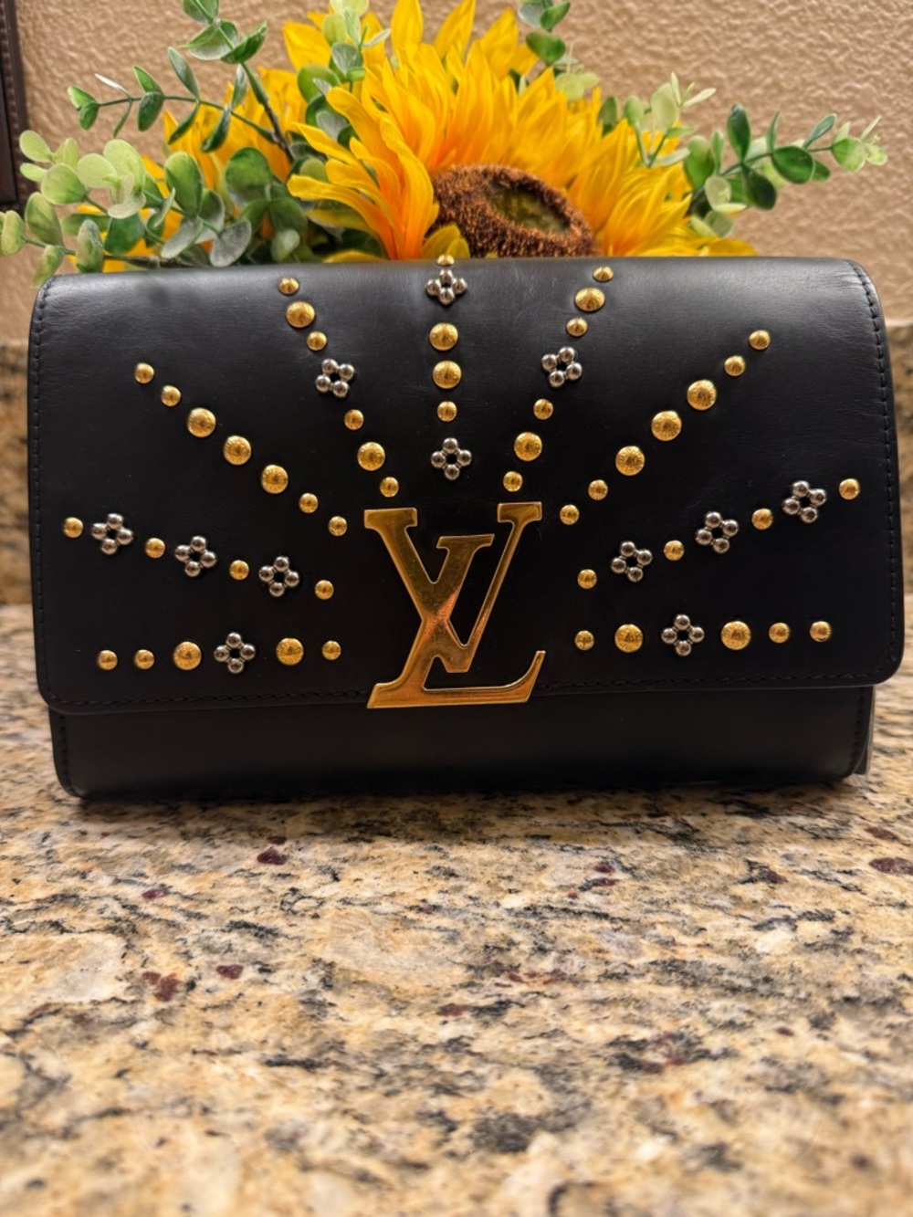 Louis Vuitton Black Clutch with Gold Accents